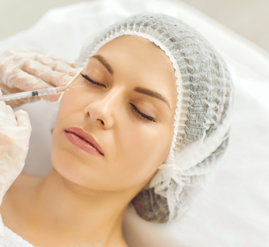 Woman undergoing dermal under-eye filler treatment