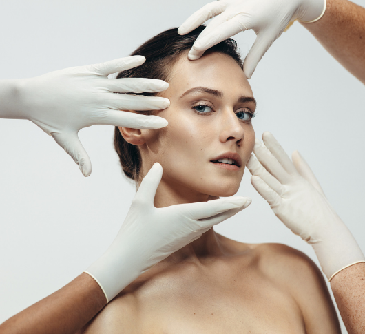 Practitioner assessing woman’s facial skin