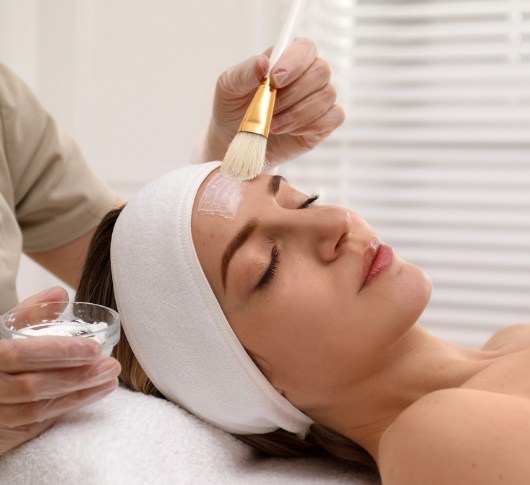 Practitioner applying gentle facial peel