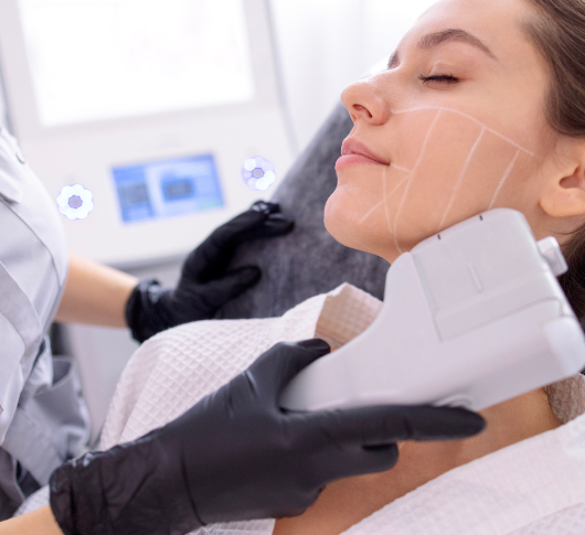 Aesthetic Professional in gloves applying HIFU to a patient's lower face and neck for skin firming and lifting procedure