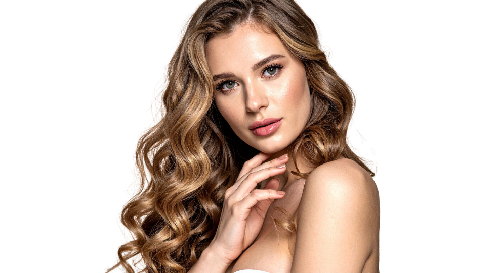 Blonde woman with wavy hair gently touching her face