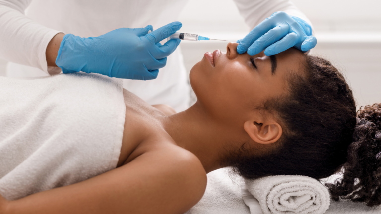 Woman receiving precise nose filler treatment