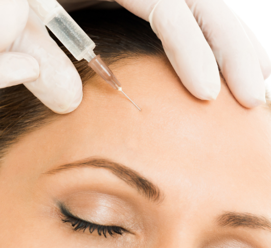 Close-up of toxin injection for forehead lines treatment