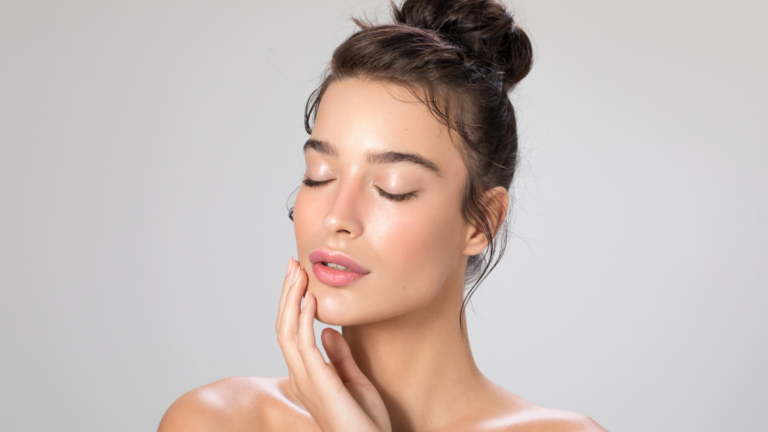 Close-up of woman with glowing skin